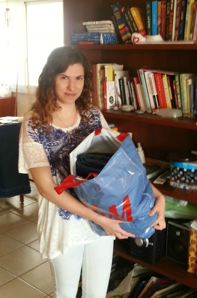 Me with a bag of clothes for donation